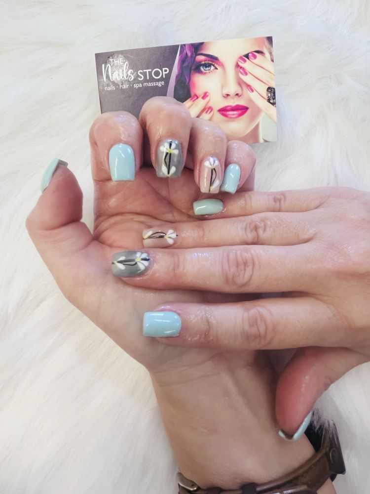 Mint and grey nails with delicate hand-painted daisy nail art in Chula Vista
